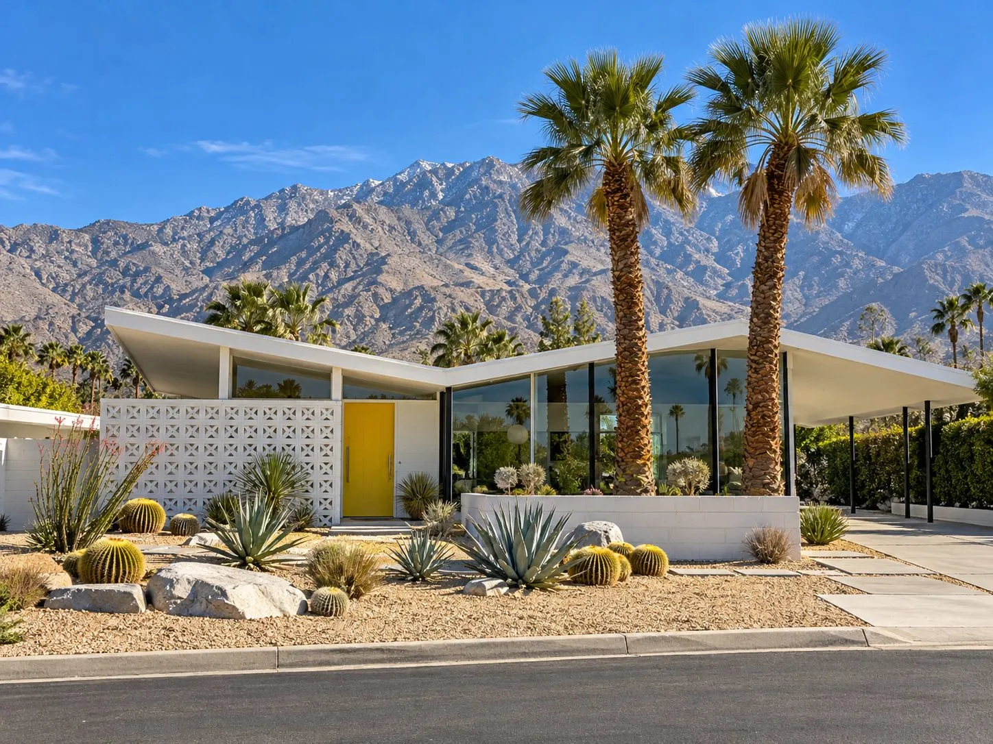 Property illustration: a clean mid-century butterfly-roof home beneath Mount San Jacinto in Palm Springs