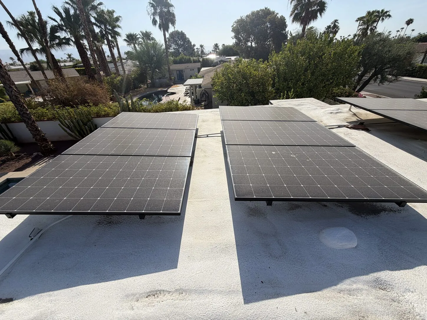 Job photo: two dusty solar rows on a Palm Springs flat roof