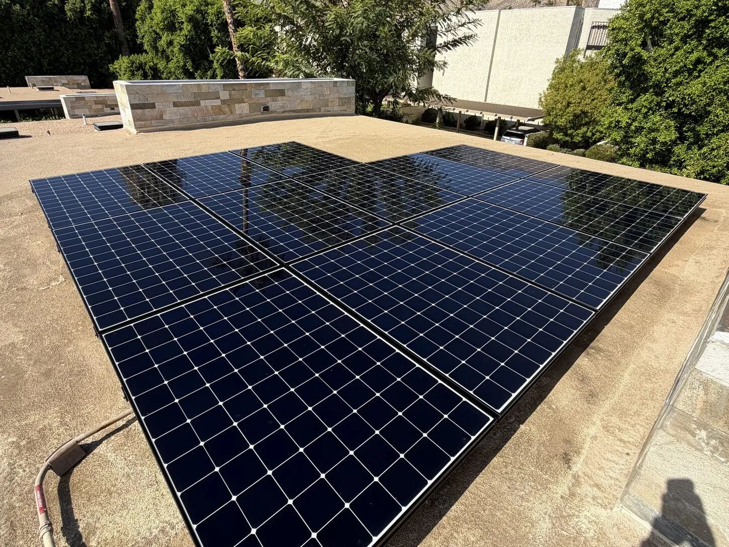 Job photo: freshly cleaned solar rows on a Palm Springs mid-century flat roof