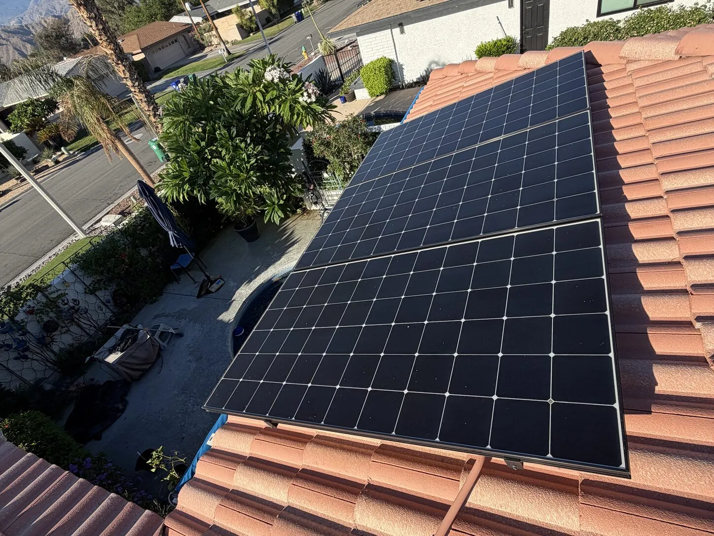 Job photo: a cleaned solar array on a Palm Desert clay-tile roof