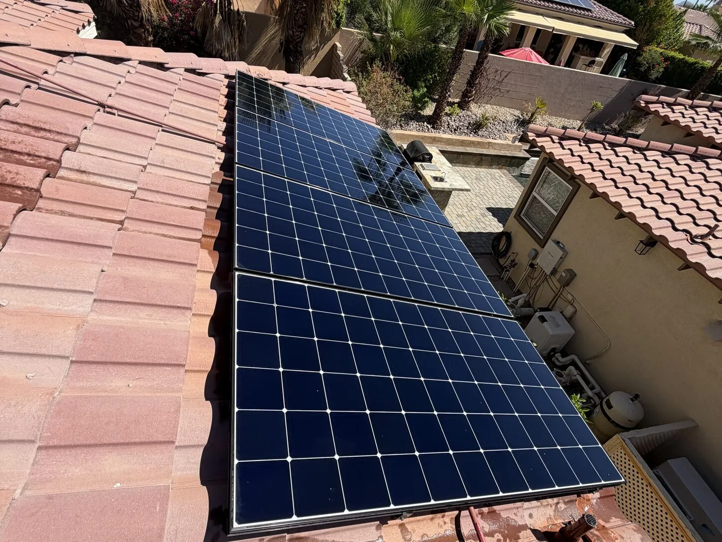 Job photo: a cleaned solar array on a Rancho Mirage clay-tile roof