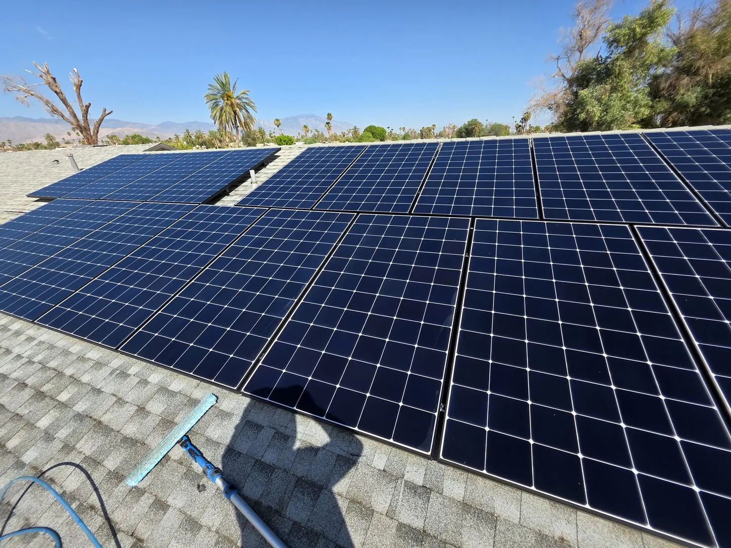 Job photo: the same Palm Desert solar panels, clean and deep blue