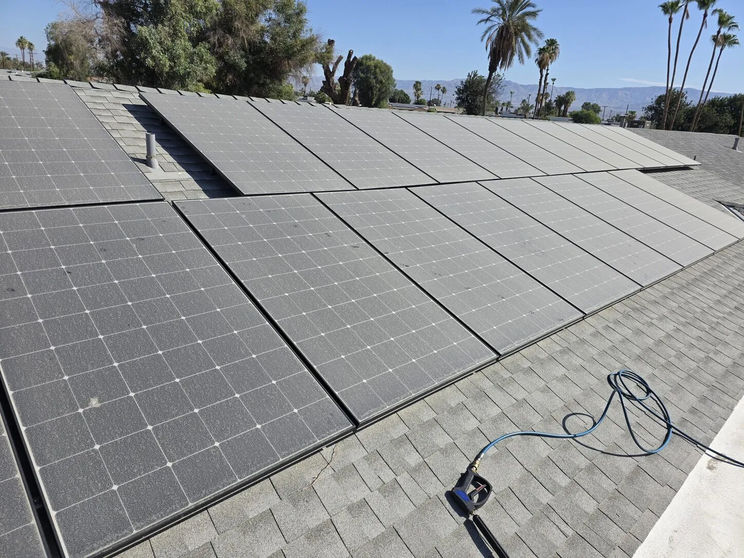 Job photo: dusty gray solar panels on a Palm Desert shingle roof