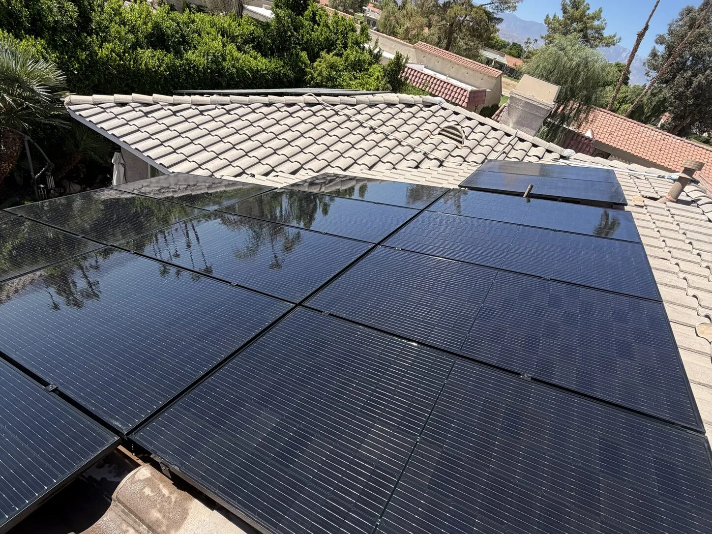Job photo: freshly cleaned solar panels on a Palm Desert clay-tile roof