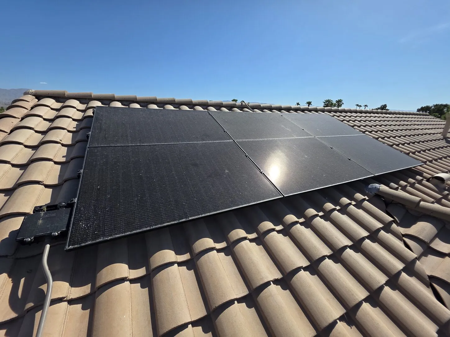Job photo: freshly cleaned solar panels on a clay-tile roof