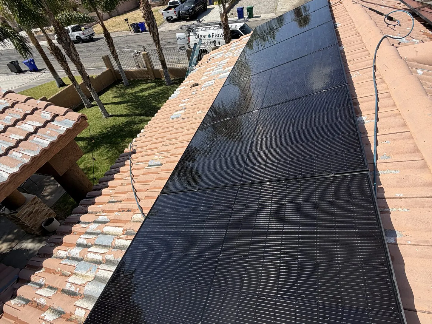 Job photo: freshly cleaned solar panels on a Cathedral City clay-tile roof