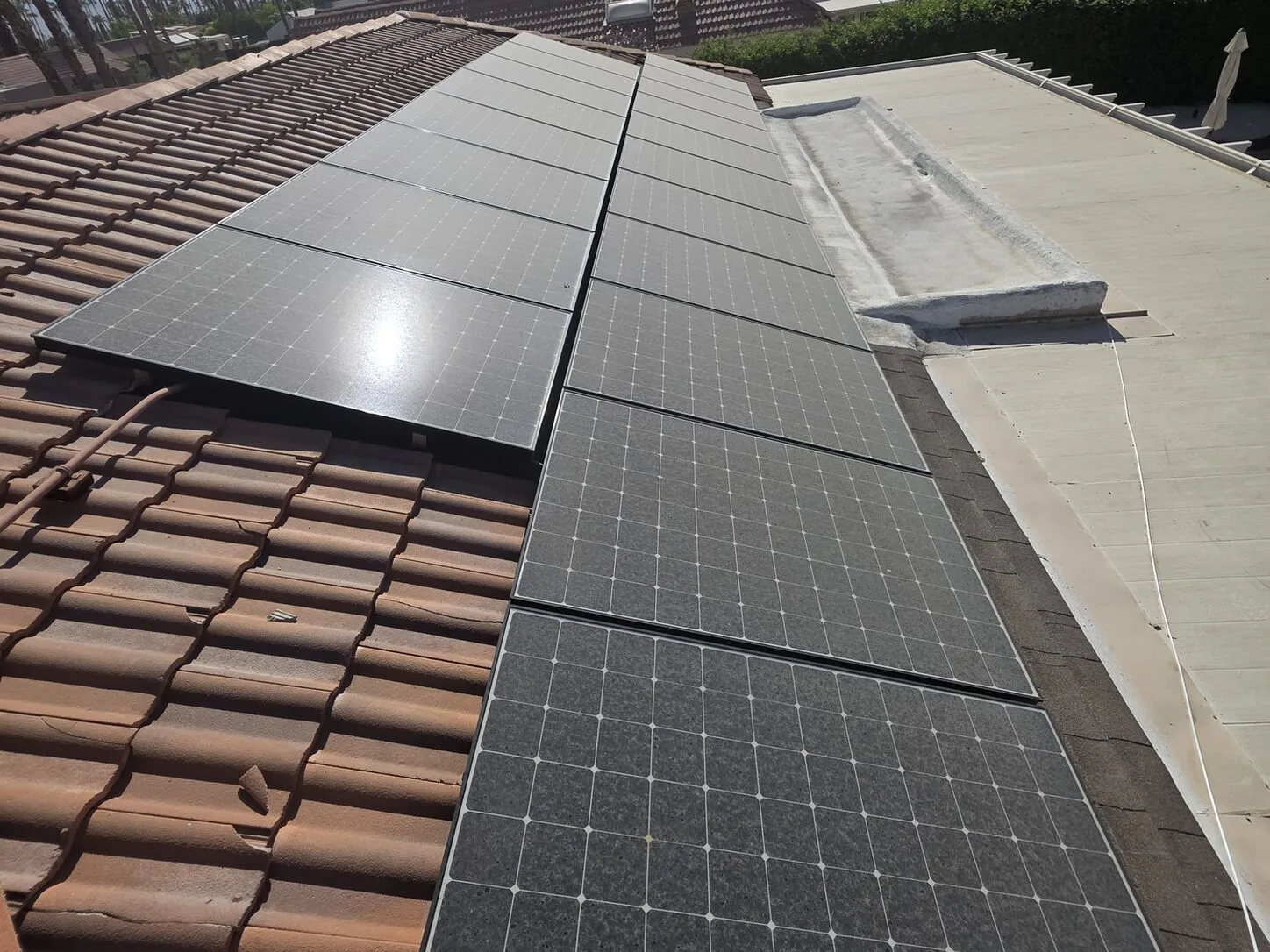 Job photo: dusty solar panels on a Palm Springs clay-tile roof