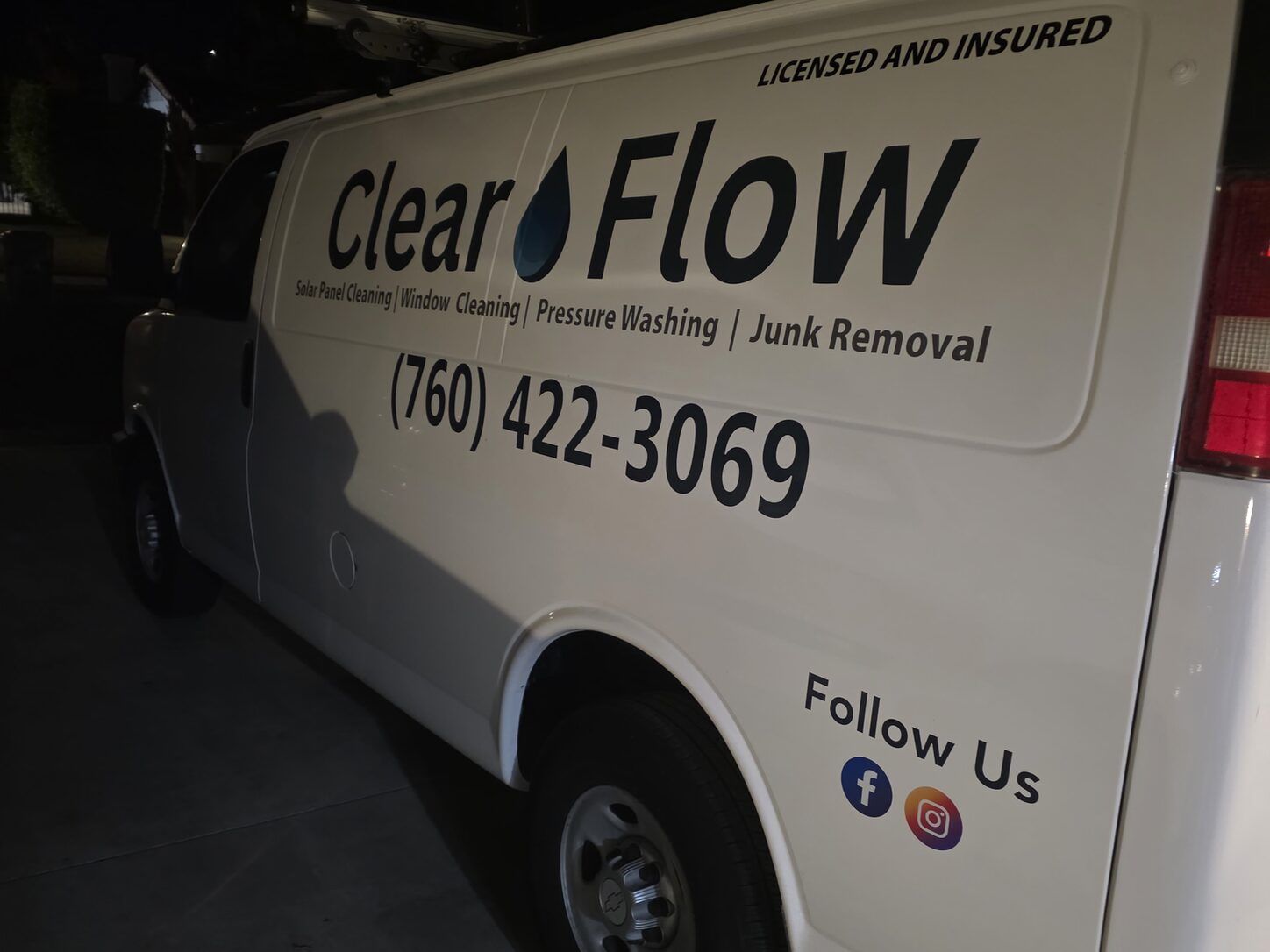 Photo: the Clear Flow work van, lettered with the company name, services and 760-422-3069