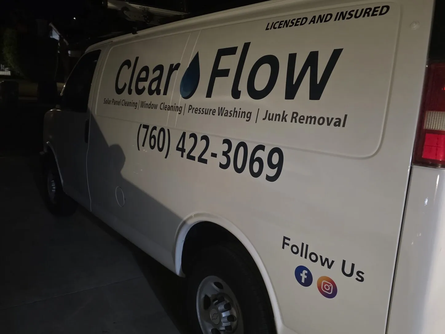 Photo: the Clear Flow work van, lettered with the company name, services and 760-422-3069