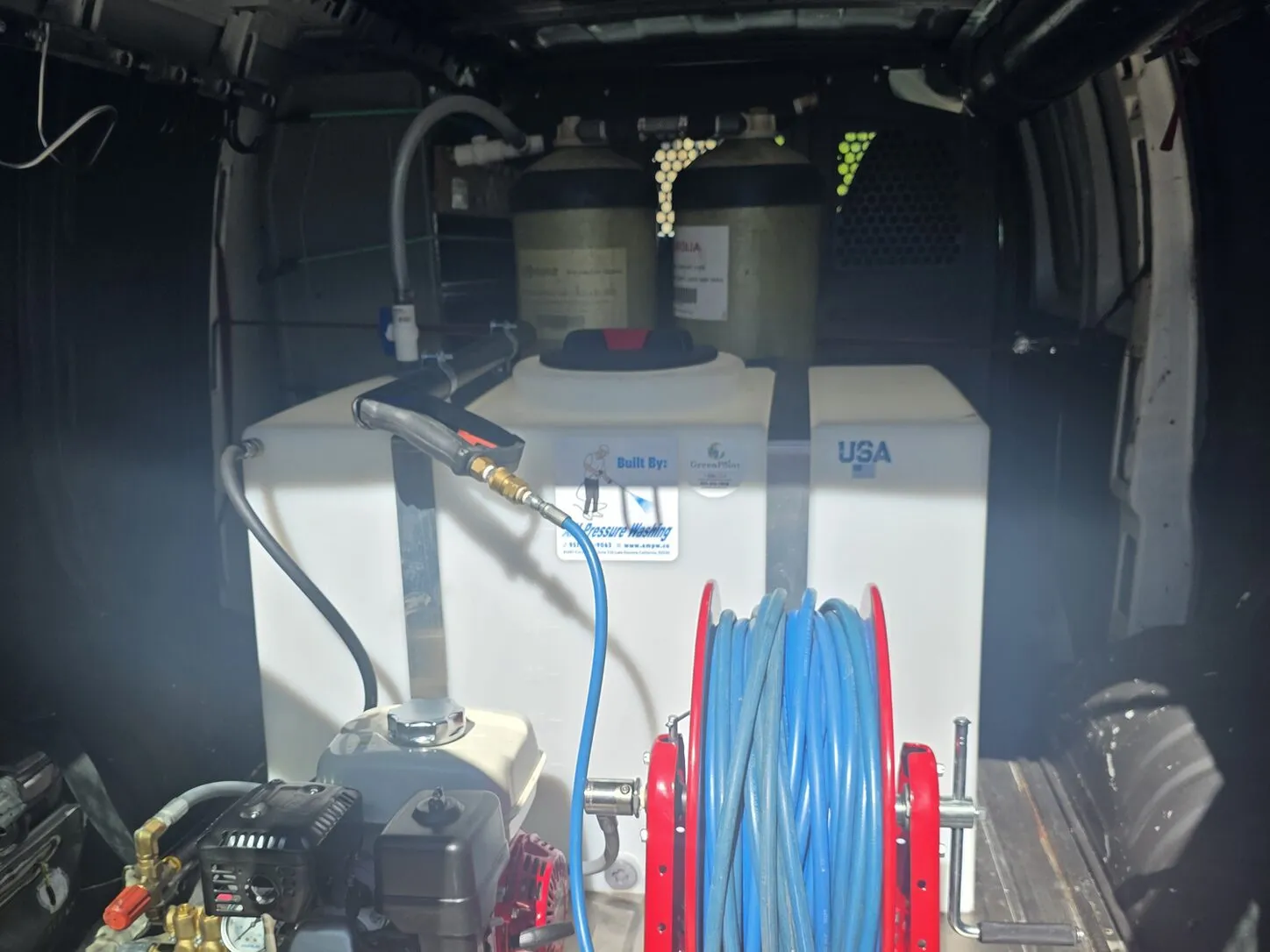 Photo: the Clear Flow van rig, with filter tanks, a water tank, a pressure washer and a hose reel