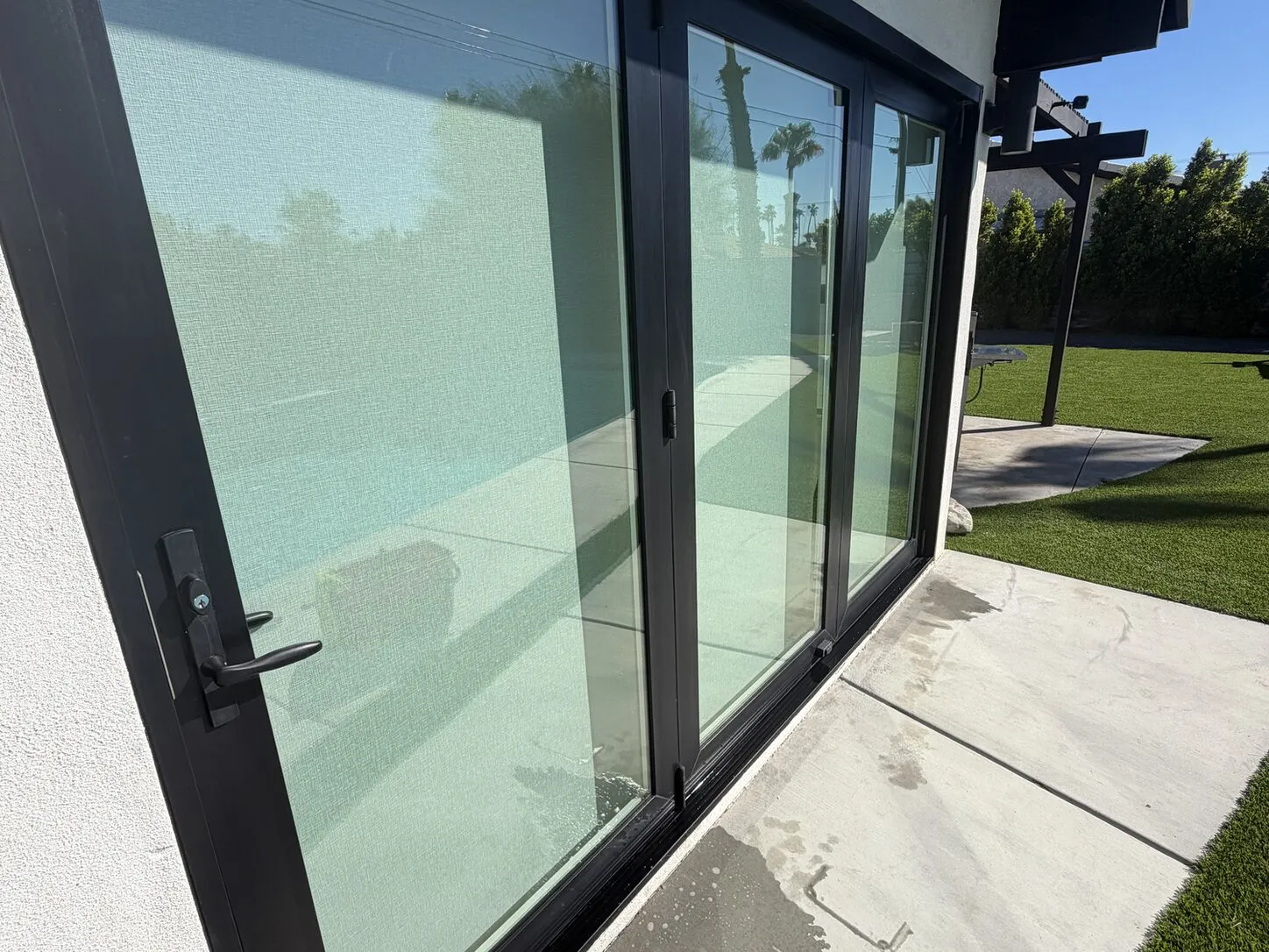 Job photo: clean black-framed glass doors at a modern Palm Springs home